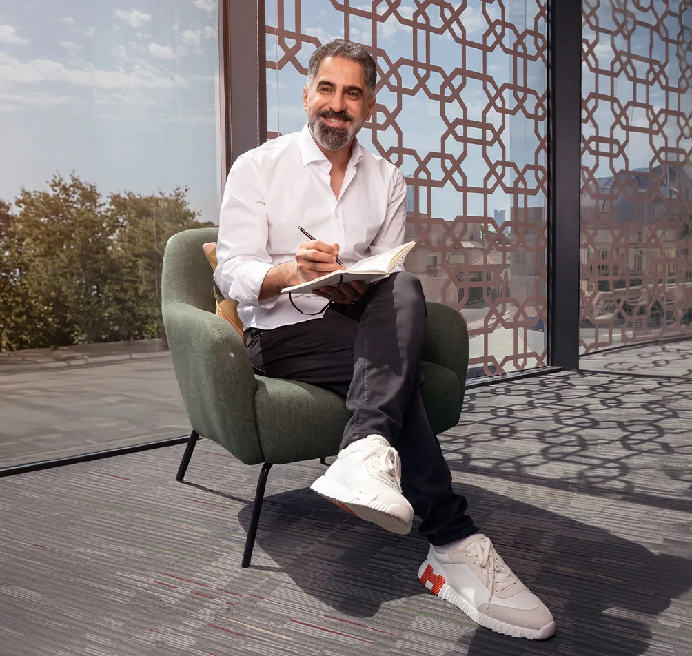 Tam Dental consultant seated in the clinic office in Jeddah
