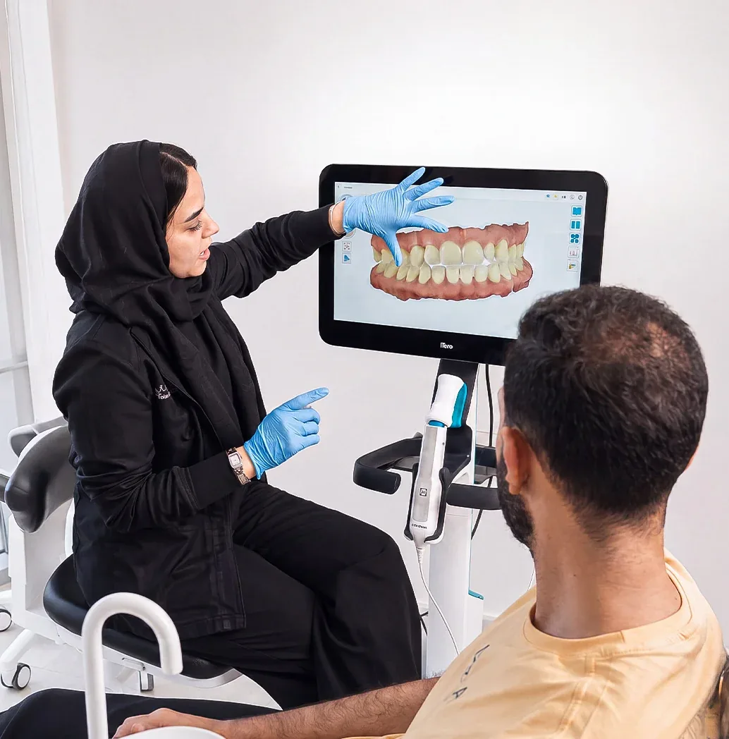 dentist-explaining-intraoral-scan-follow-up-tam-dental