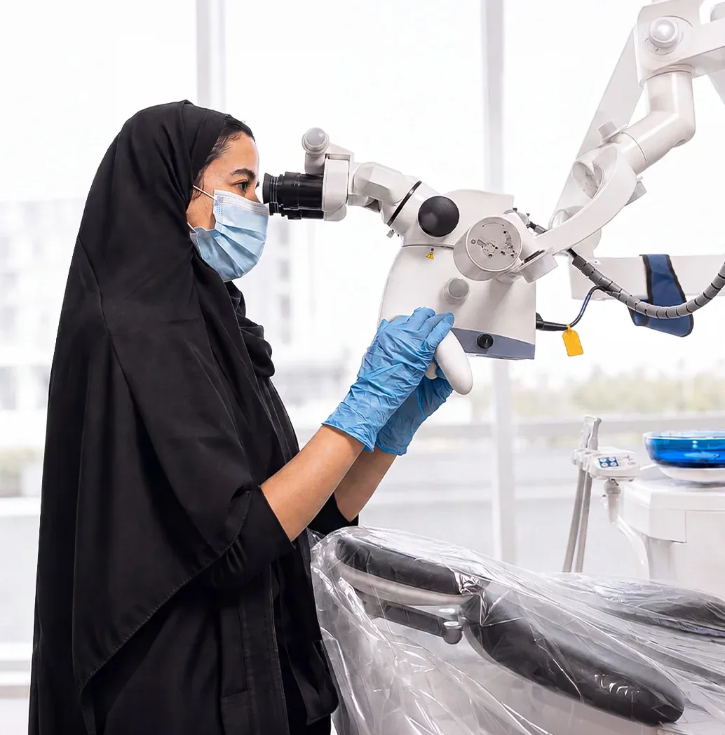 dentist-using-dental-microscope-tam-dental-jeddah