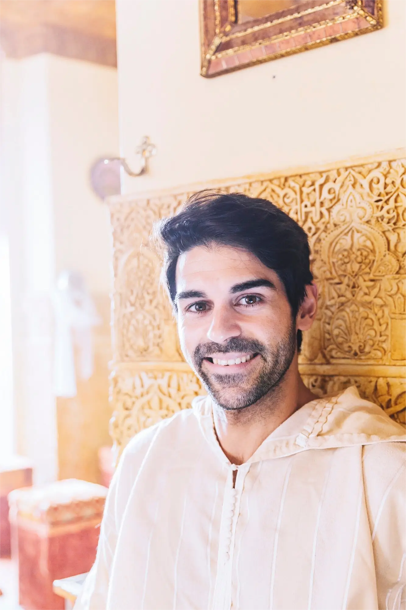 smiling-man-traditional-dress-hajj-umrah-visitor